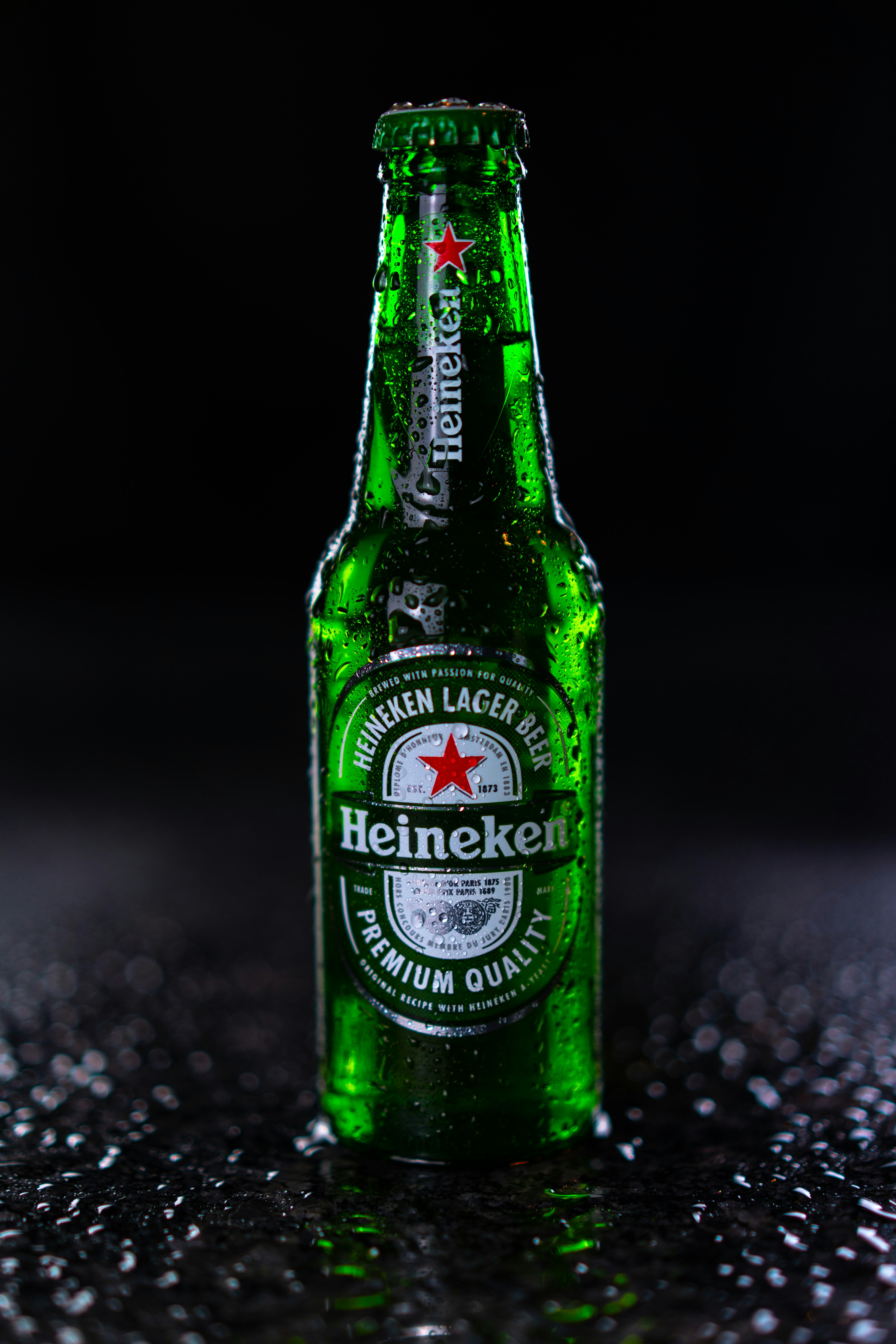 heineken bottle on black and white marble table